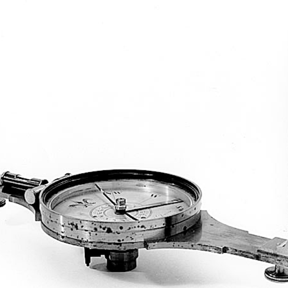 A black and white photo of an old watch.